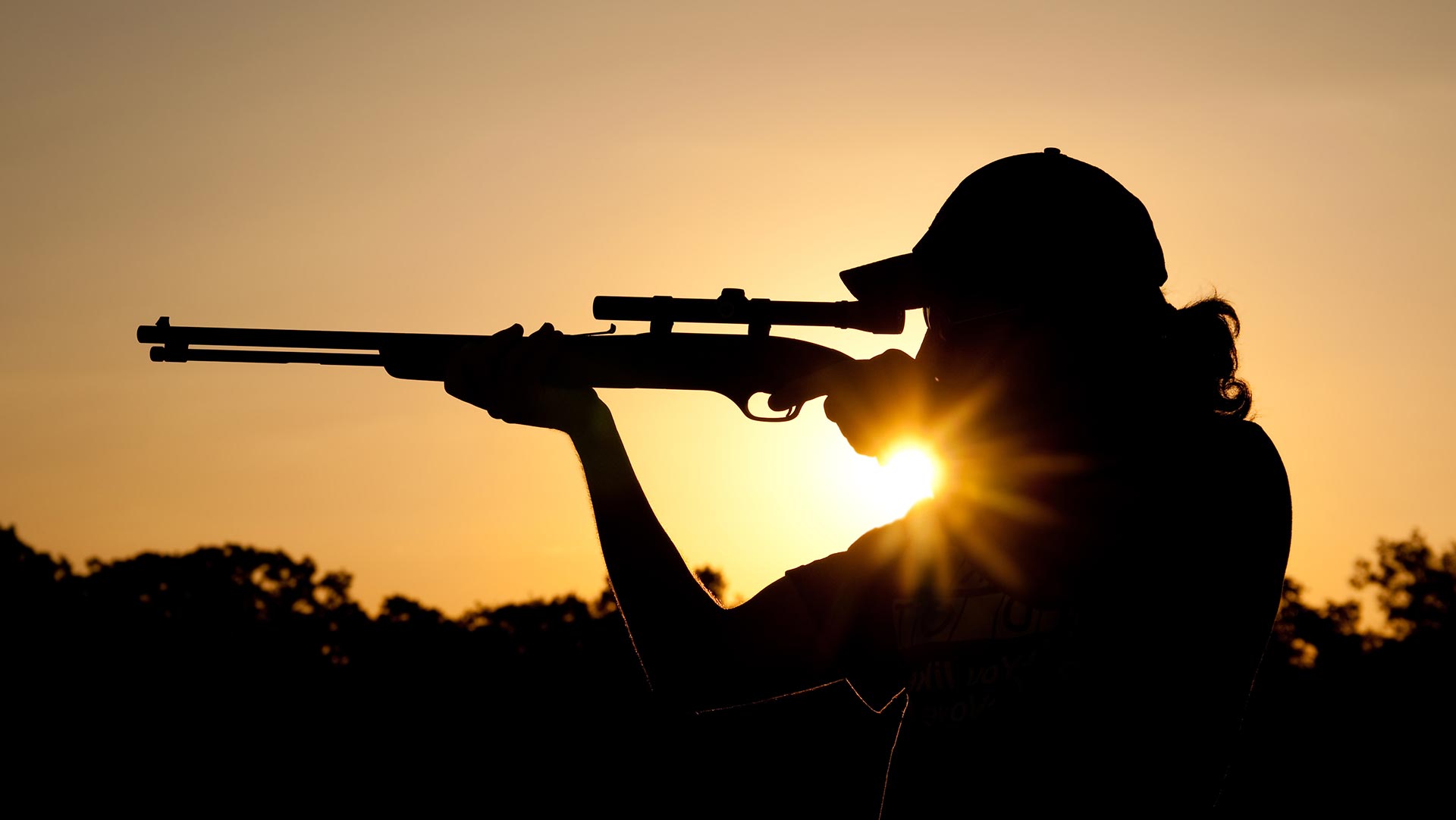 A shooter practicing at sunset